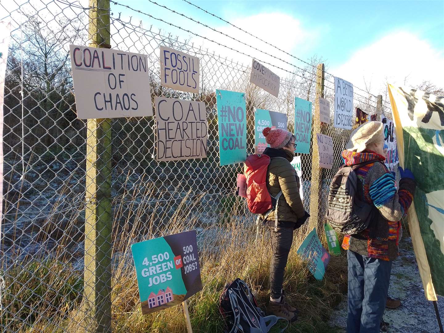 The protesters hung up banners saying messages including: “Fossil Fools” (Friends of the Earth)