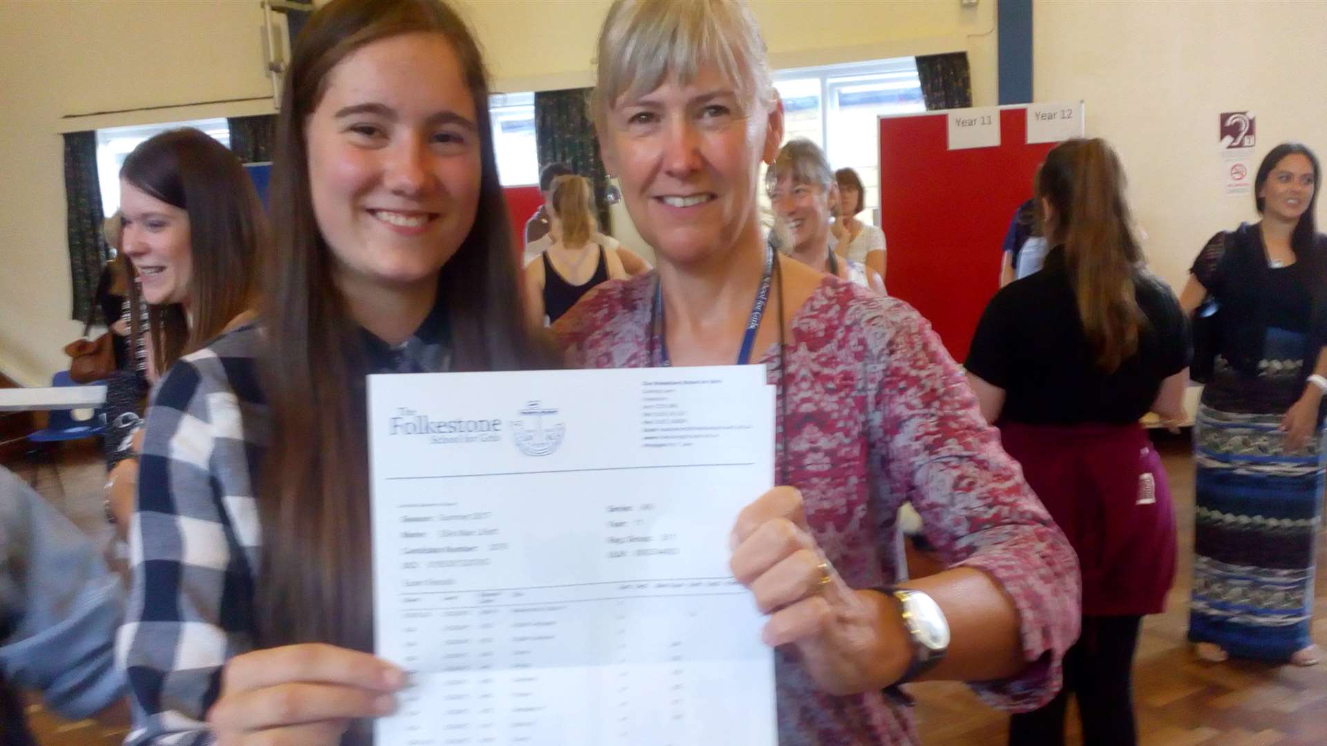 Ellie Lilliott, 16, with headteacher Tracy Luke. She scored Two 9s and an 8