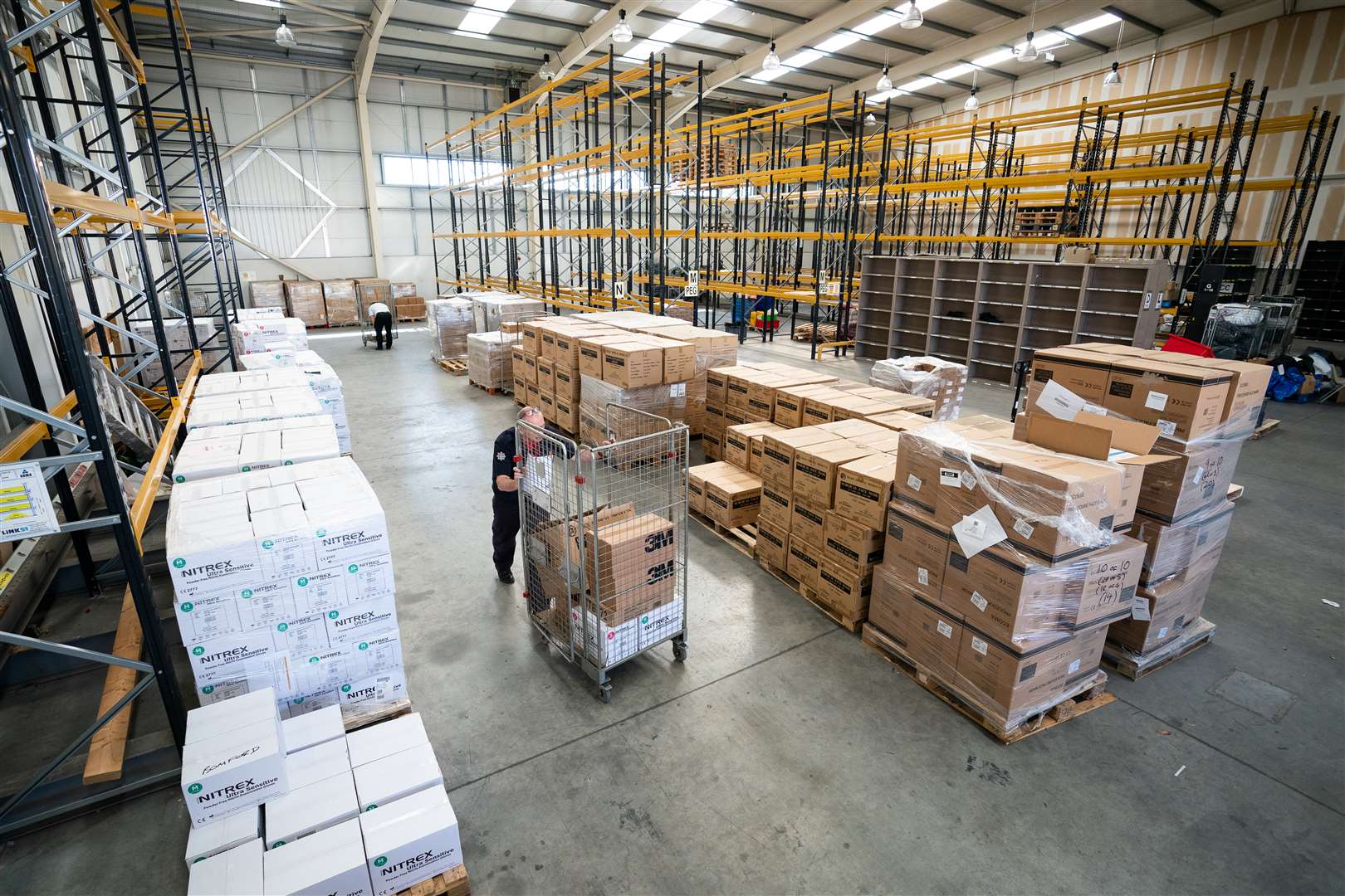 Staff are volunteering to distribute up to 20 orders of PPE across London a day (Aaron Chown/PA)