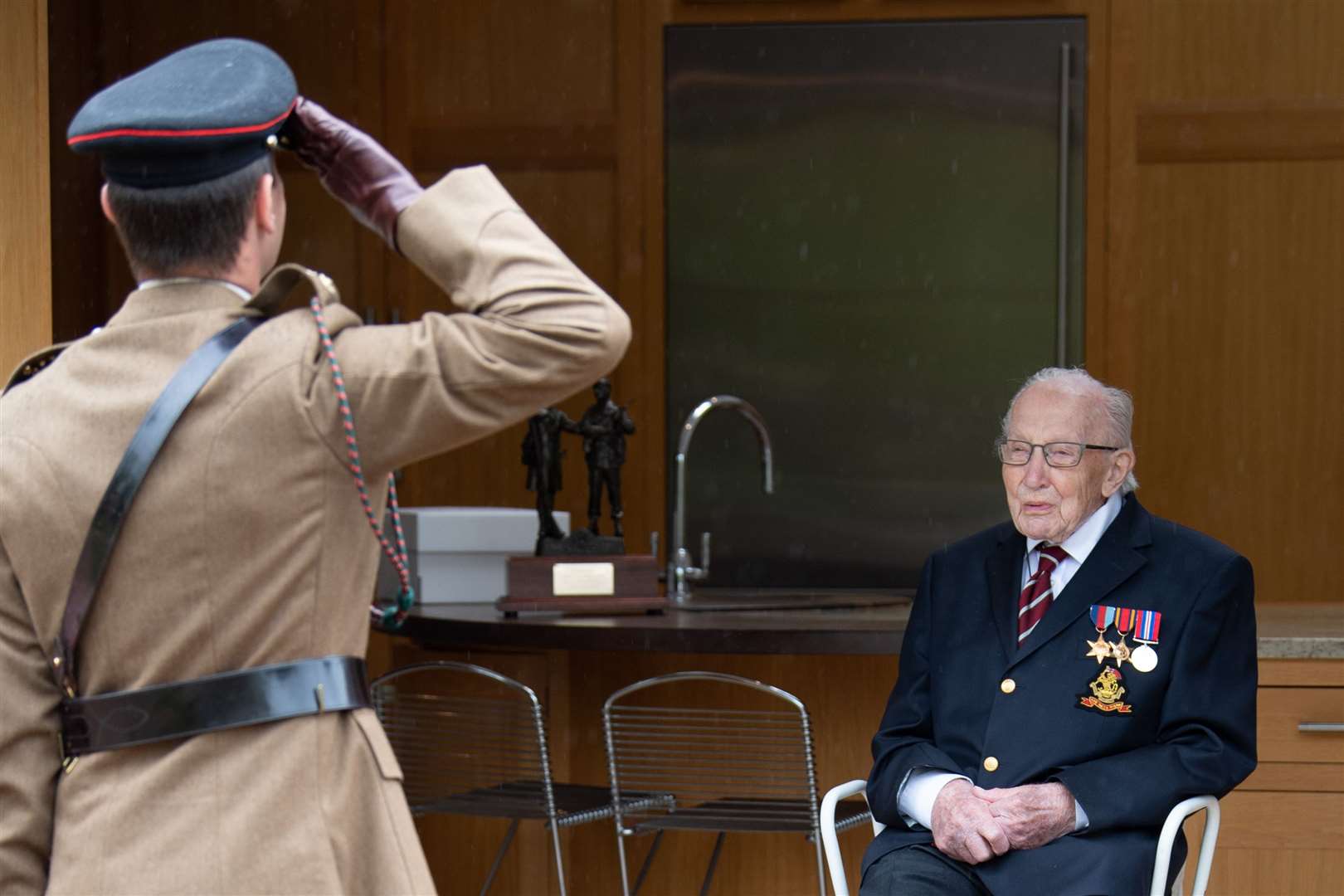 Lieutenant Colonel Thomas Miller, Commanding Officer of 1st Battalion The Yorkshire Regiment, salutes Sir Tom Moore (Cpl Robert Weidemane/MoD/Crown Copyright/PA)