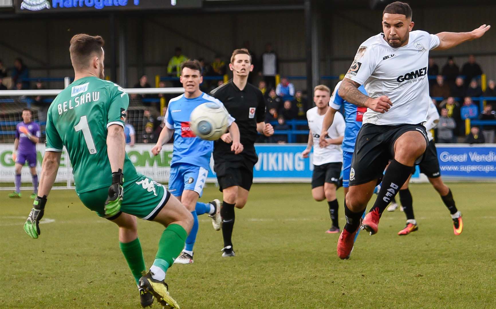 Dover midfielder Jai Reason is denied by Harrogate keeper James Belshaw Picture: Alan Langley