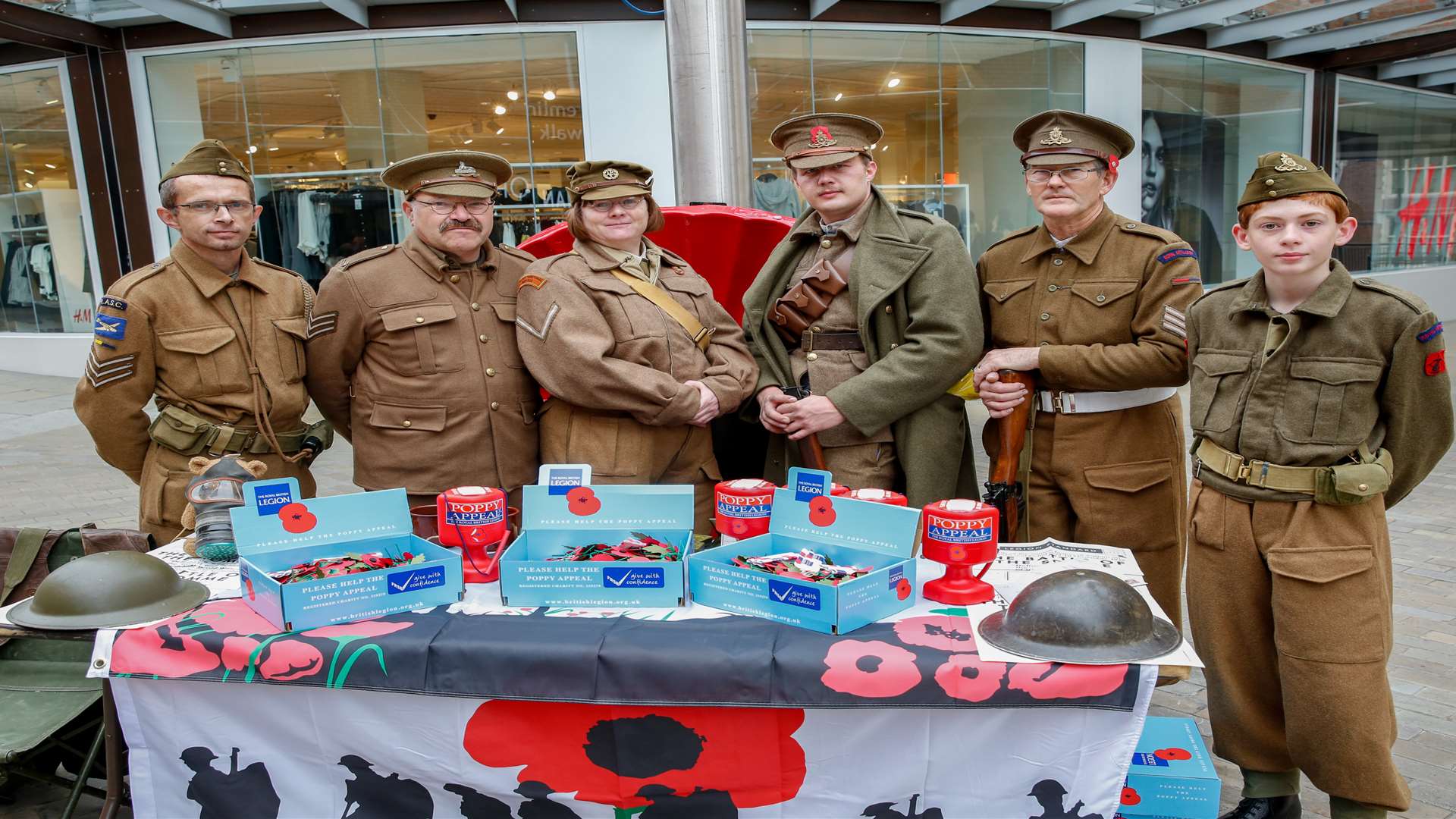 Re-enactors Group Assault 1st Brigade Workshop REME sell poppies at Fremlin Walk, Maidstone. L-R Ian Williamham, Tim Warrener, Ann Veitch, Phillip Jopson, Mark Savage and James Veitch. Picture by: Matthew Walker