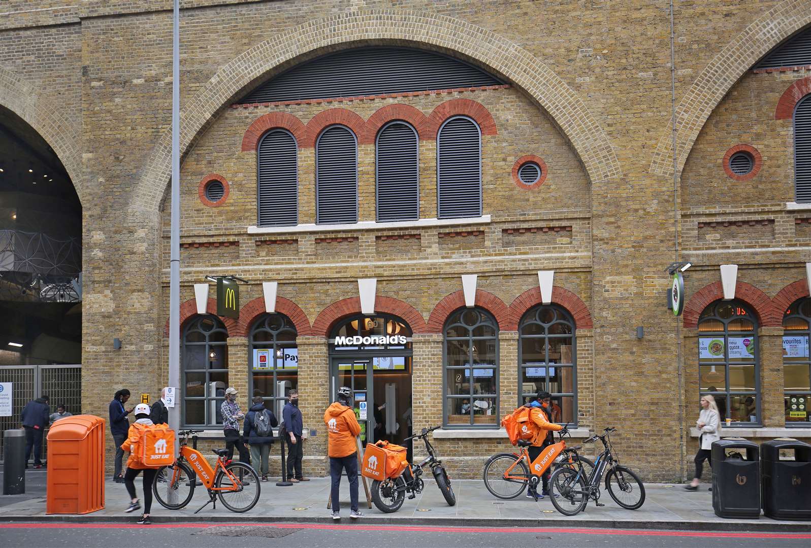 Just Eat drivers outside McDonalds at London Bridge Station (Simon Turner/Alamy/PA)