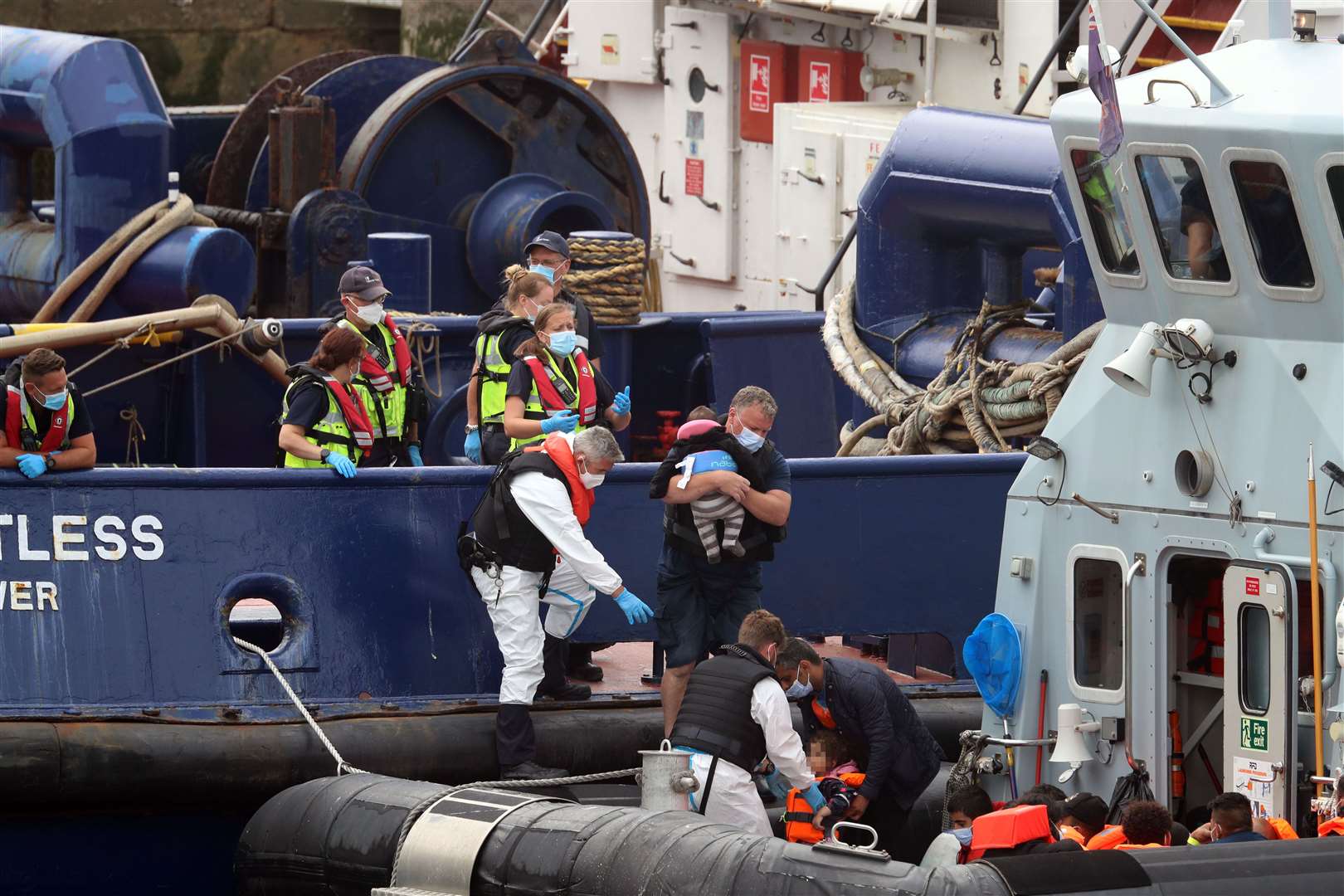 Children being escorted off boats in Dover, Kent, on Friday (Gareth Fuller/PA)