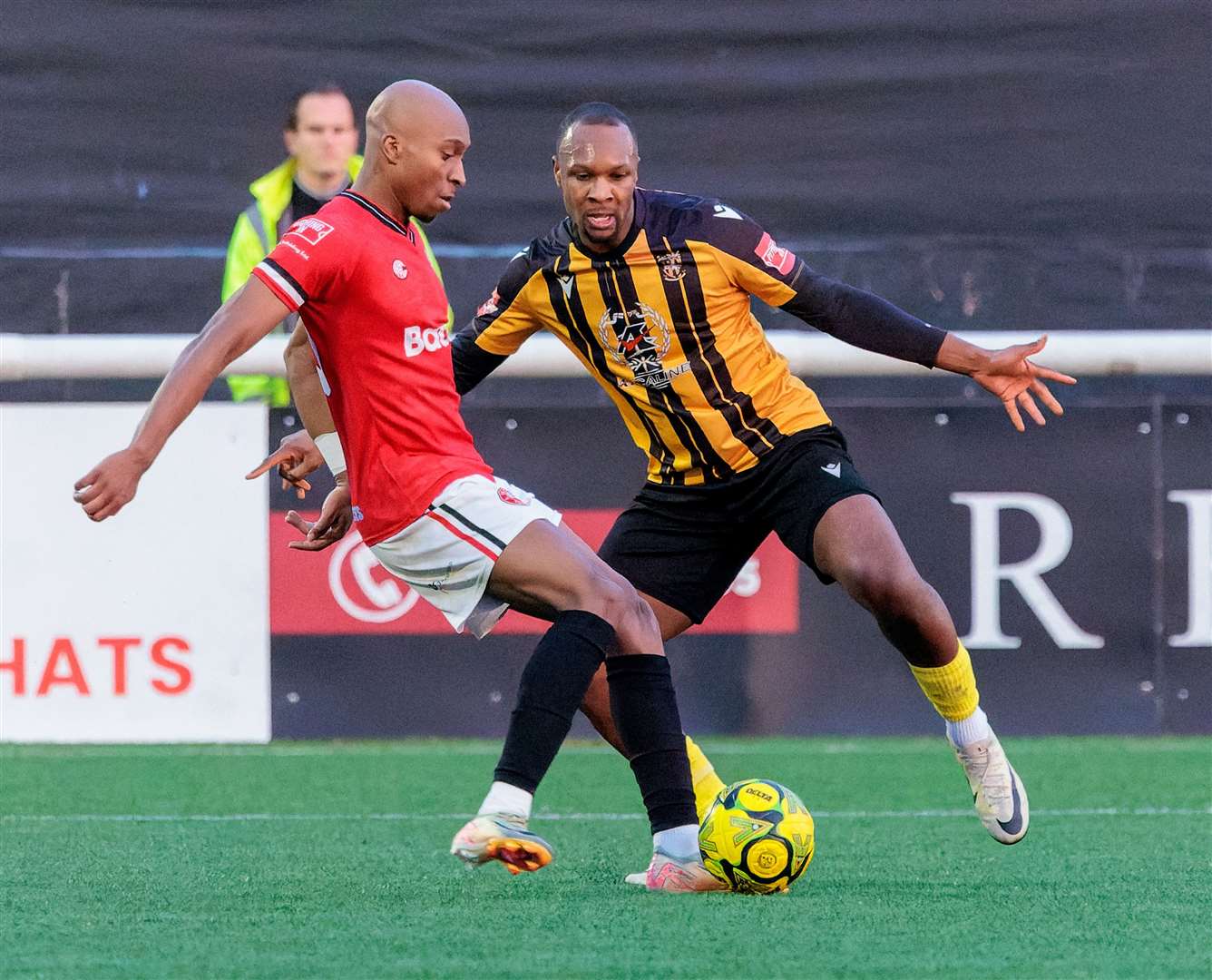 Folkestone Invicta defender Gavin Hoyte, right, keeps tabs on John Ufuah, of Chatham. Picture: Helen Cooper