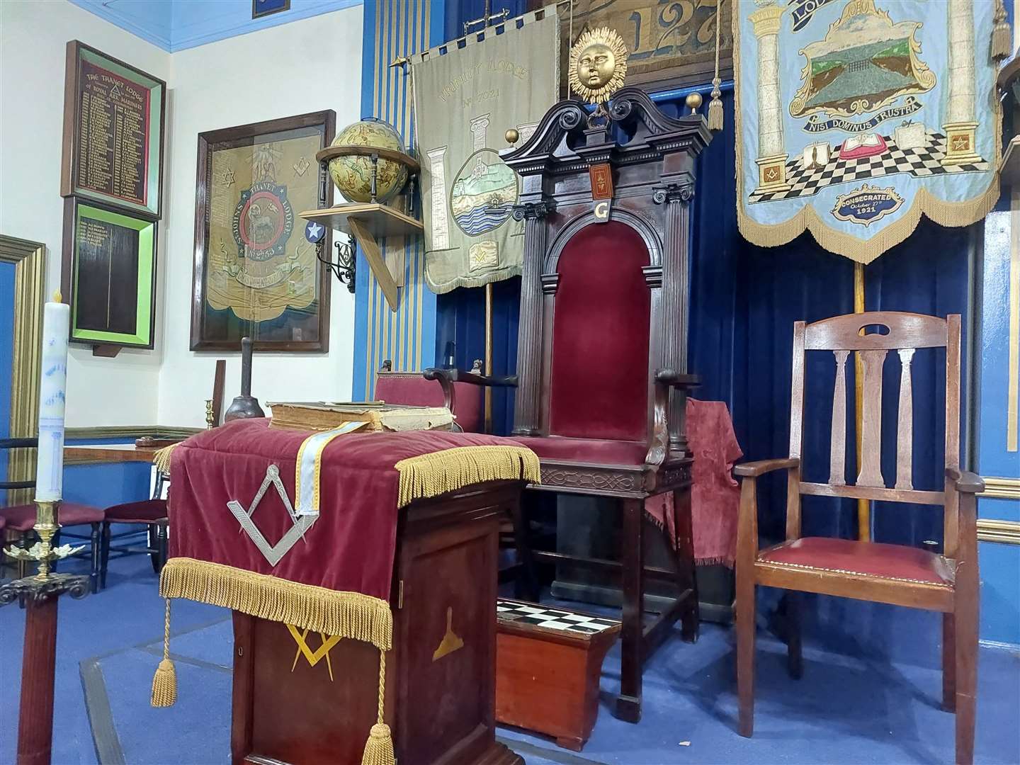 At one end of the hall sits a raised, throne-like chair