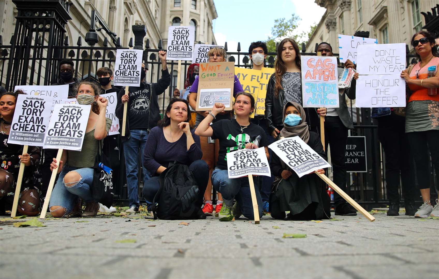 People protest outside Downing Street over the Government’s handling of exam results (Aaron Chown/PA).