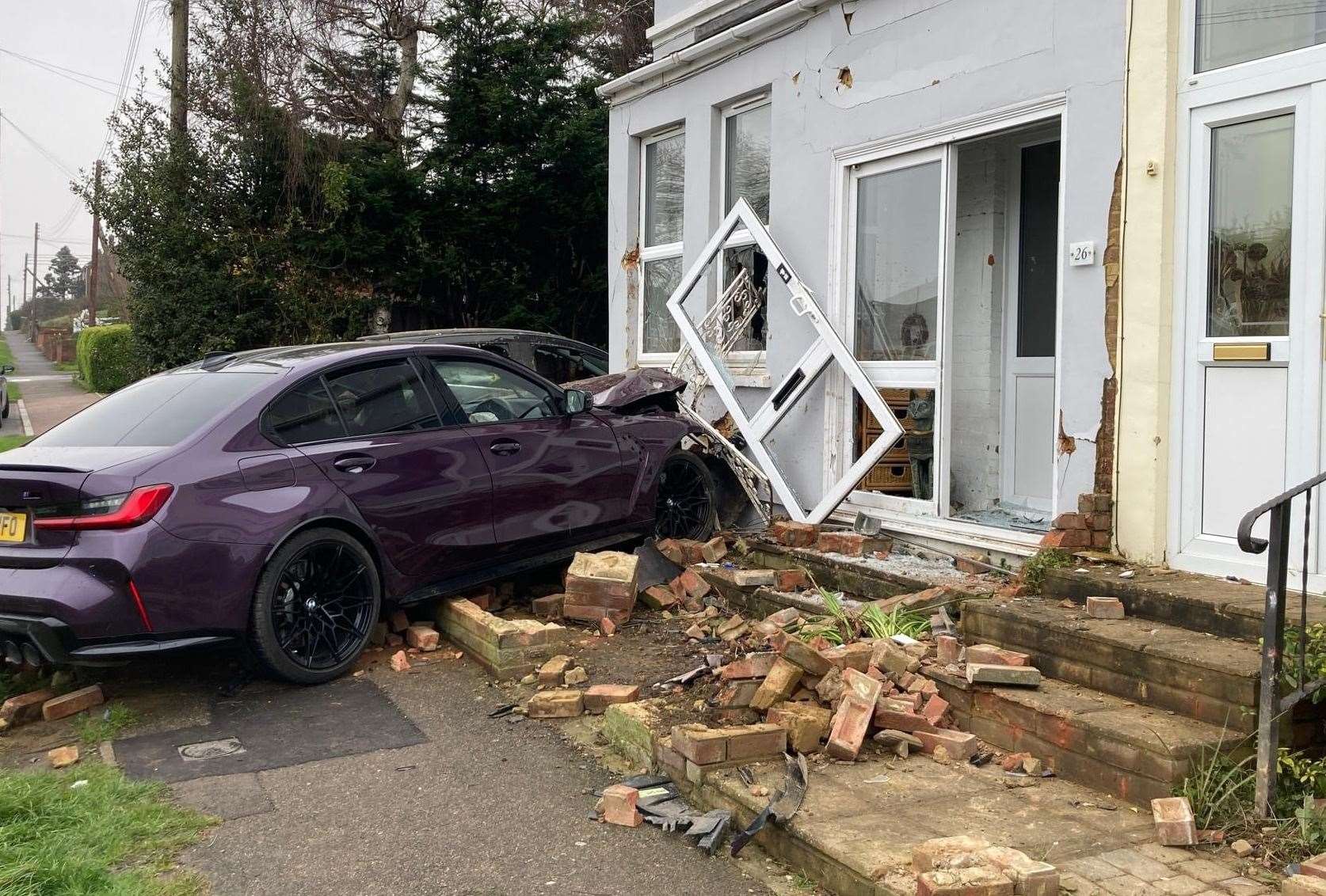 A BMW smashed into a couple's front room in The Broadway, Minster, on Monday morning. Picture: John Nurden