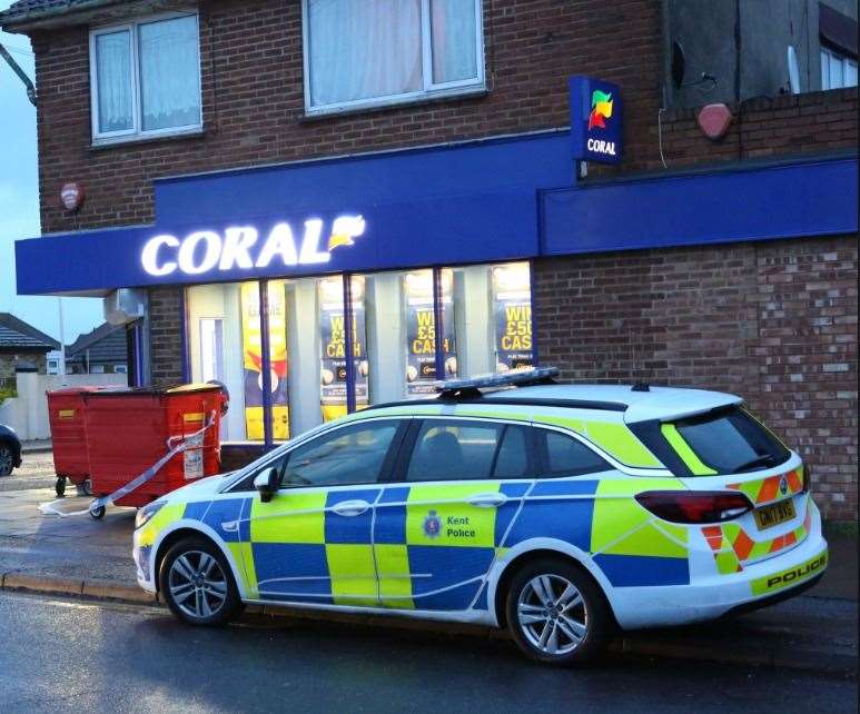 Police outside Coral in Newington Road yesterday