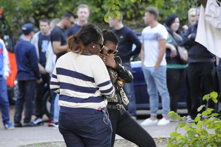 Mourners gather at the club to pay their respects