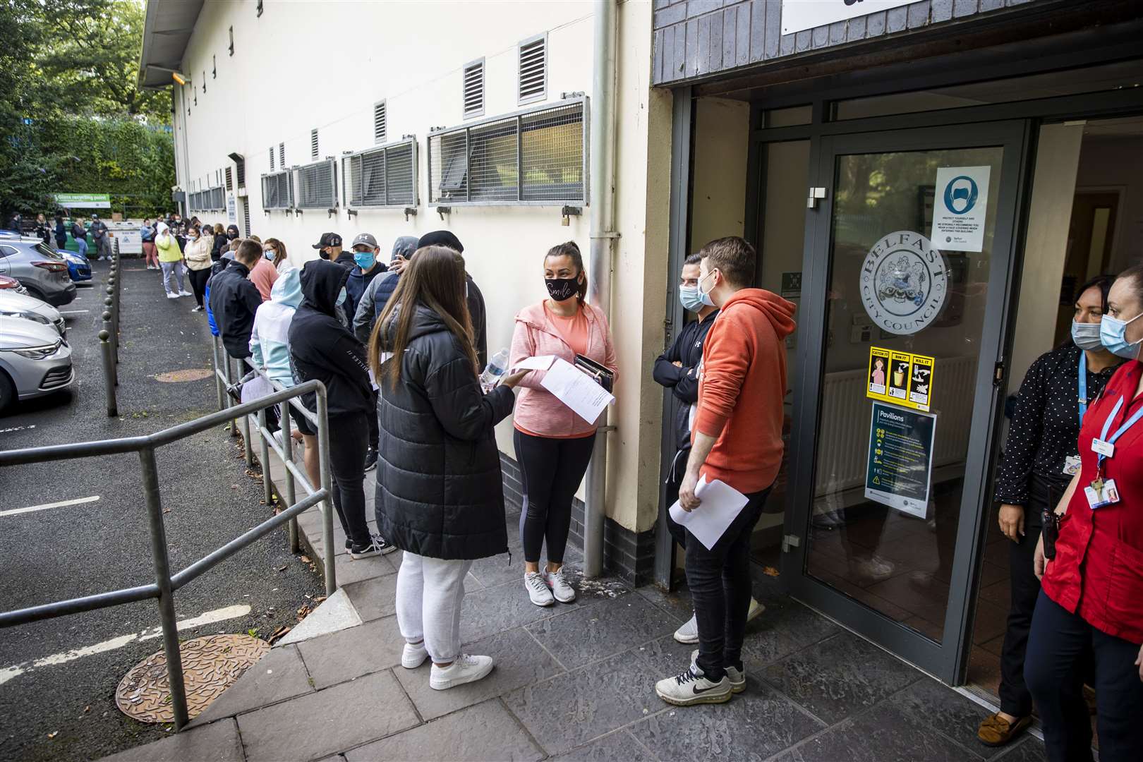 Festival goers at Feile an Phobail queuing to receive the coronavirus vaccination for an event ticket. (Liam McBurney/PA)