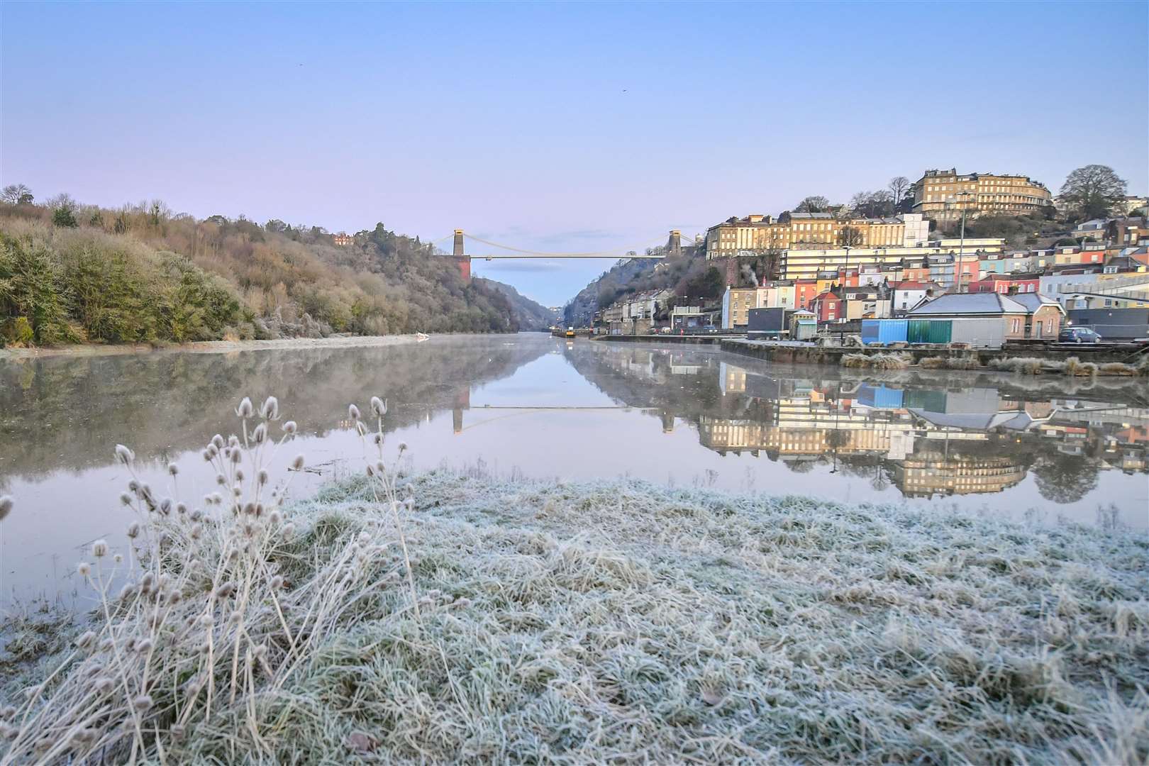 Frost covers a grassy bank looking out over the Avon Gorge and Clifton suspension bridge in Bristol after overnight temperatures dropped below freezing (Ben Birchall/PA)