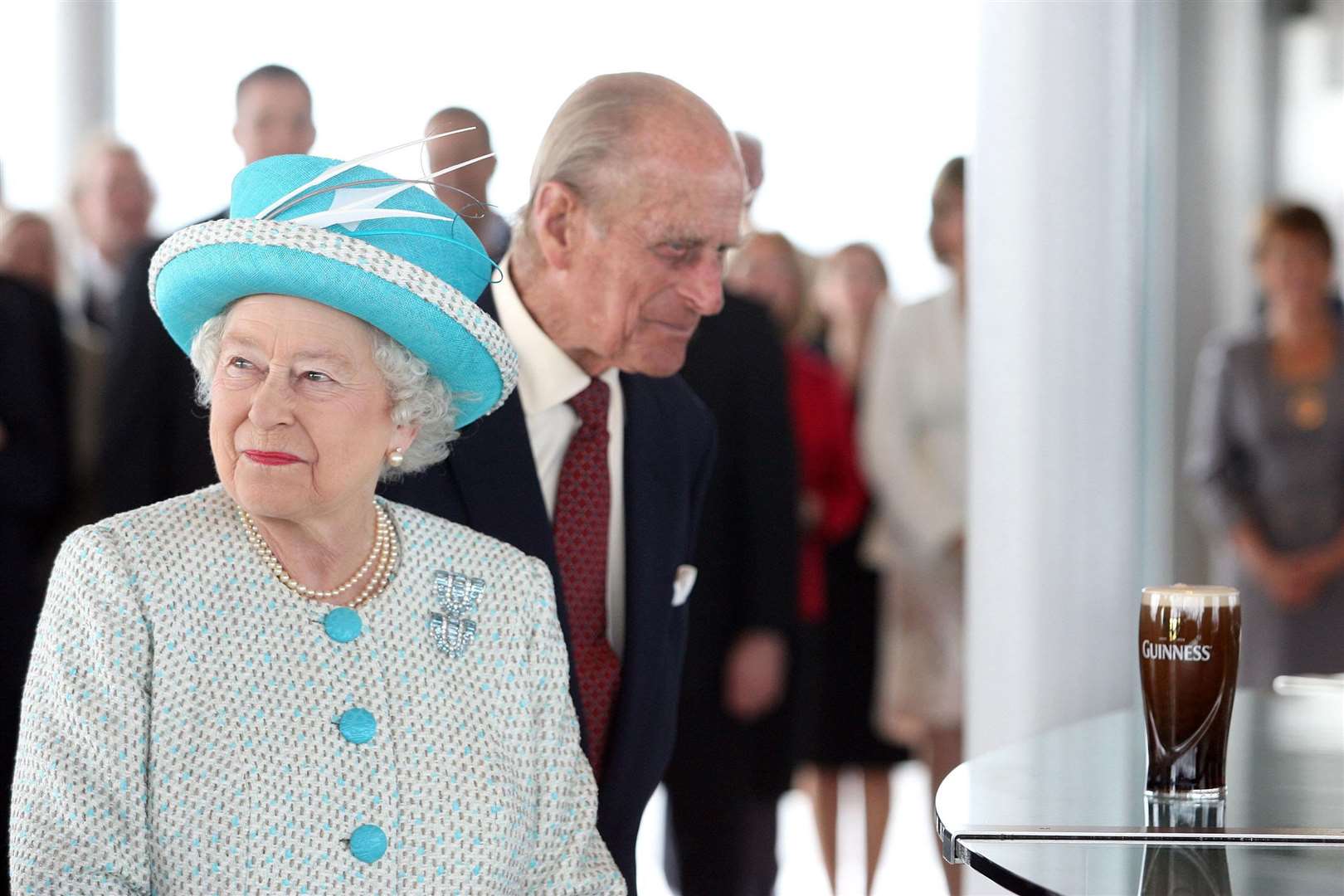 The Queen and Duke of Edinburgh receive a pint of Guinness at the Guinness Storehouse during her State Visit to Ireland in 2011 (Maxwells/PA)