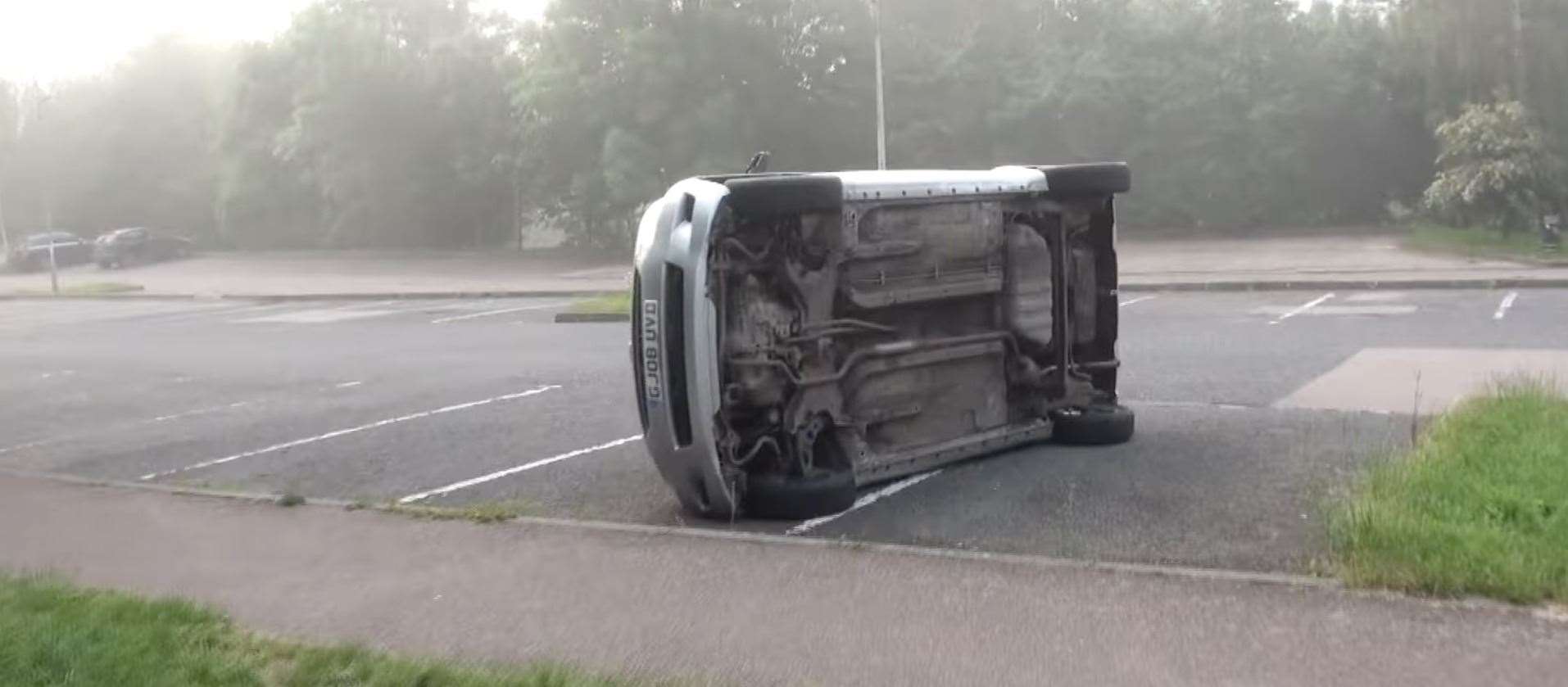 A car left in the Co-op car park was also severely damaged when tipped on its side. Picture: Simon Ashby