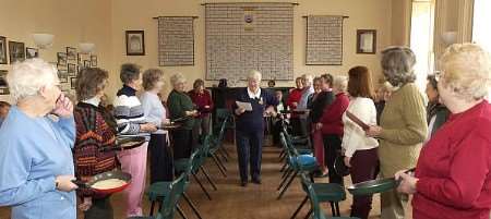 HAPPIER TIMES: The WI members gear up for their annual pancake toss in 2004