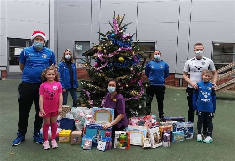 Medway United FC with some of the gifts for the children's ward at Medway Maritime Hospital