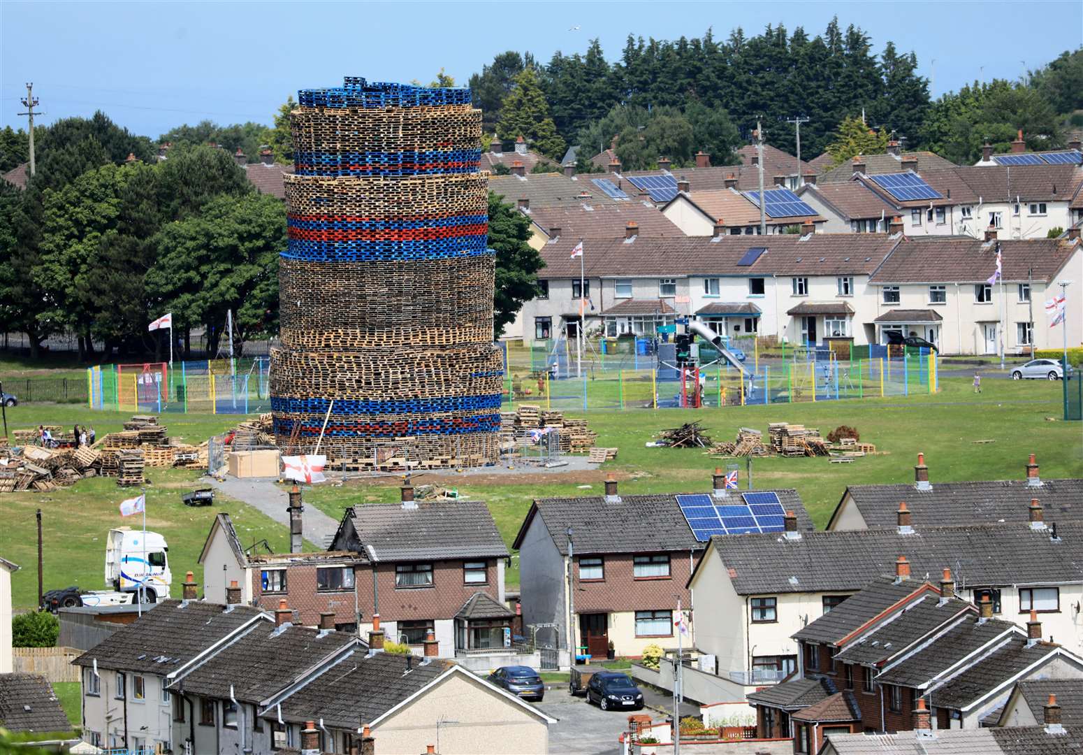 A massive bonfire in the loyalist Craigyhill area of Larne dwarfs local houses in the seaside town (Peter Morrison/PA)