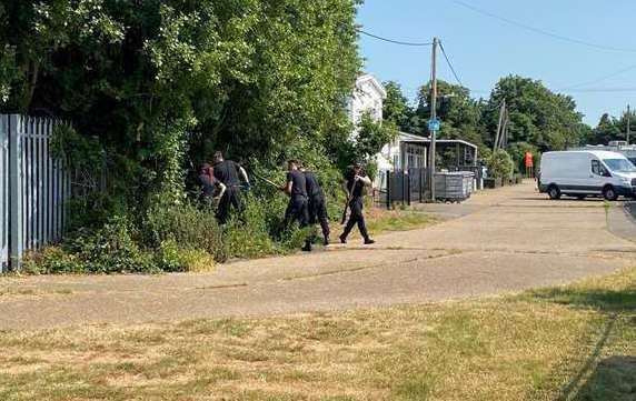 Police searching for the murder weapon at the chalet park