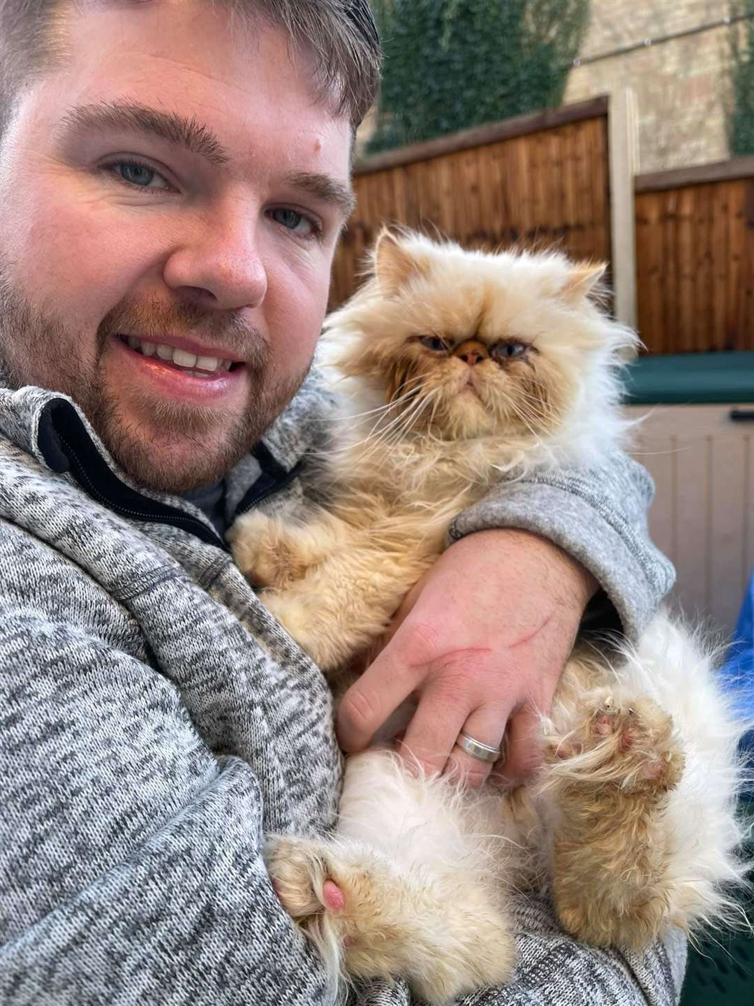 Billy Devitt with rescue cat Arthur. Picture: Wisteria Cat Rescue