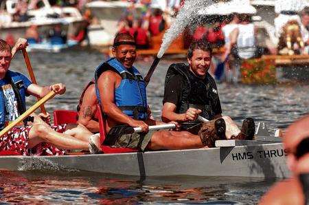 HMS Thrust spray their water jet in last year's raft race