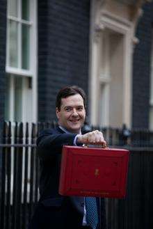 Chancellor George Osborne leaves Downing Street on Budget day