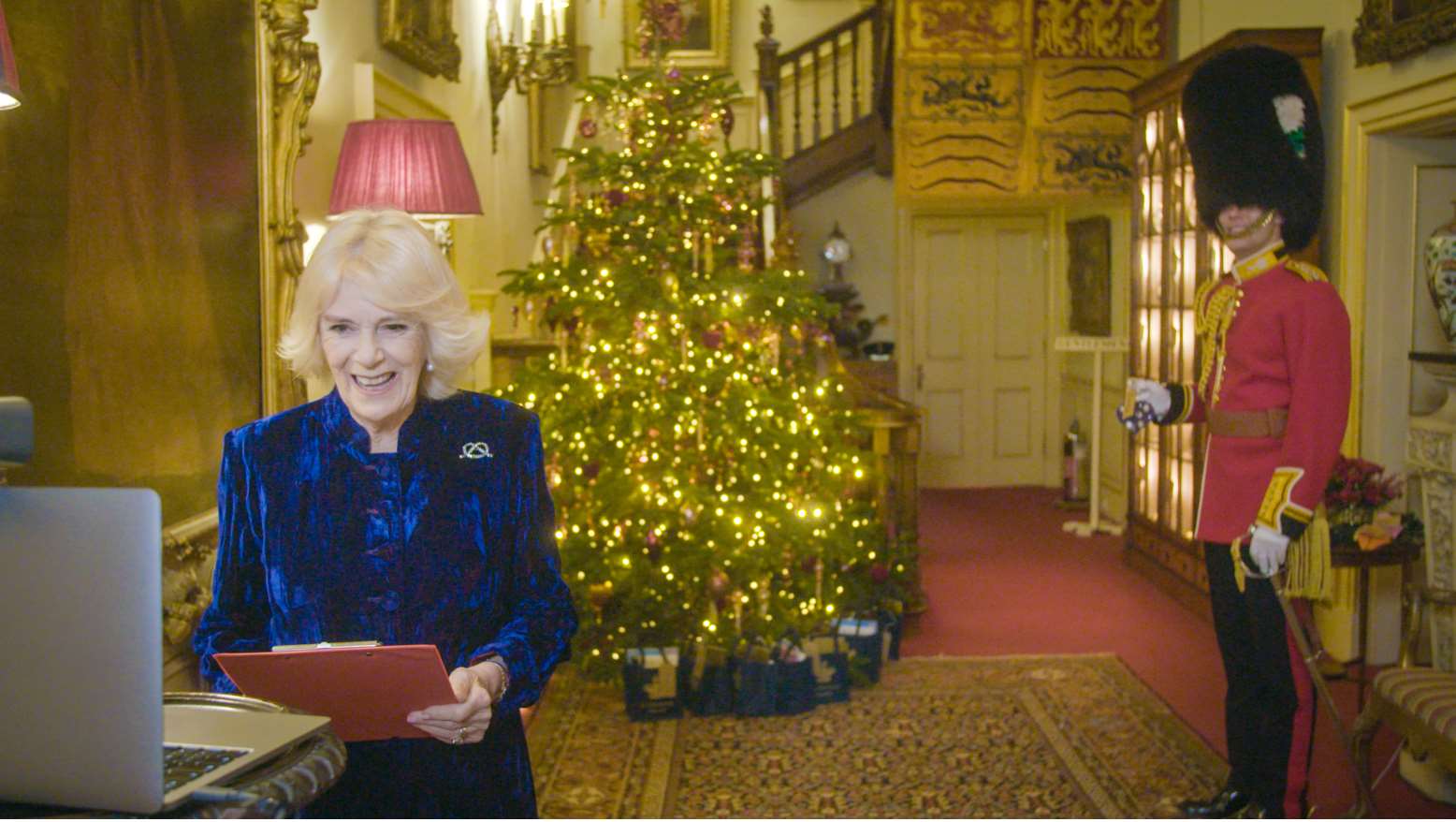 Camilla chats to the young people while her equerry watches (Clarence House/PA)