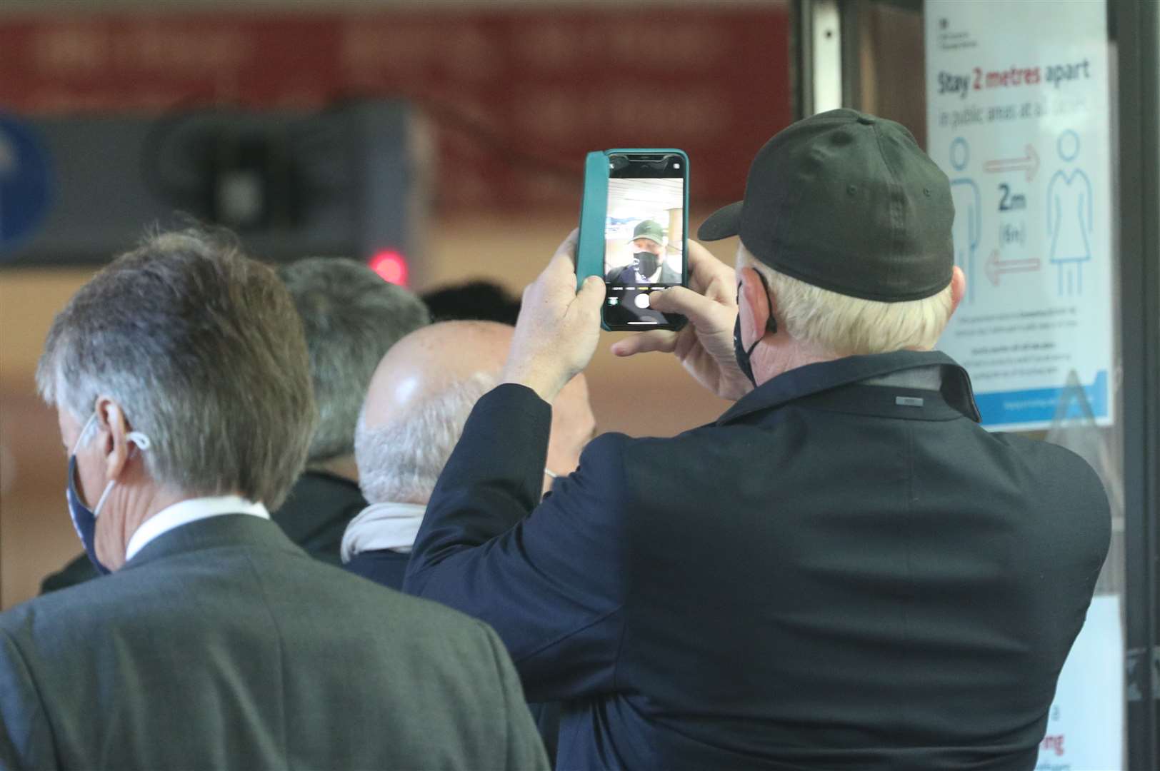 Former German tennis star Boris Becker takes a selfie as he arrives at Southwark Crown Court in London (Yui Mok/PA)