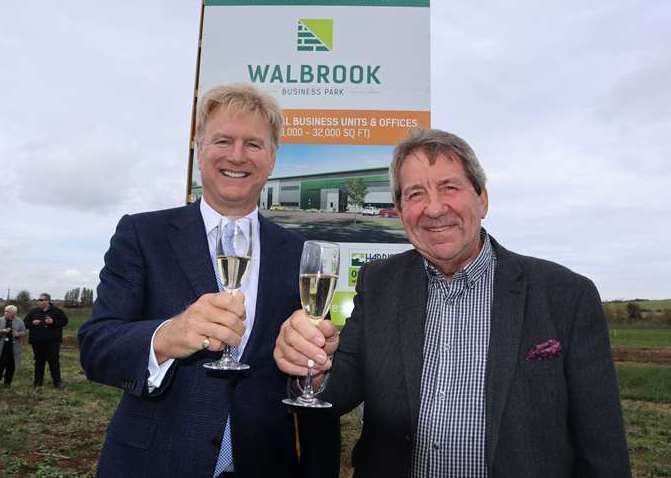 Tom Allsworth of Medichem, left, and MP Gordon Henderson toasting the launch of Walbrook Business Park at Neats Court, Queenborough