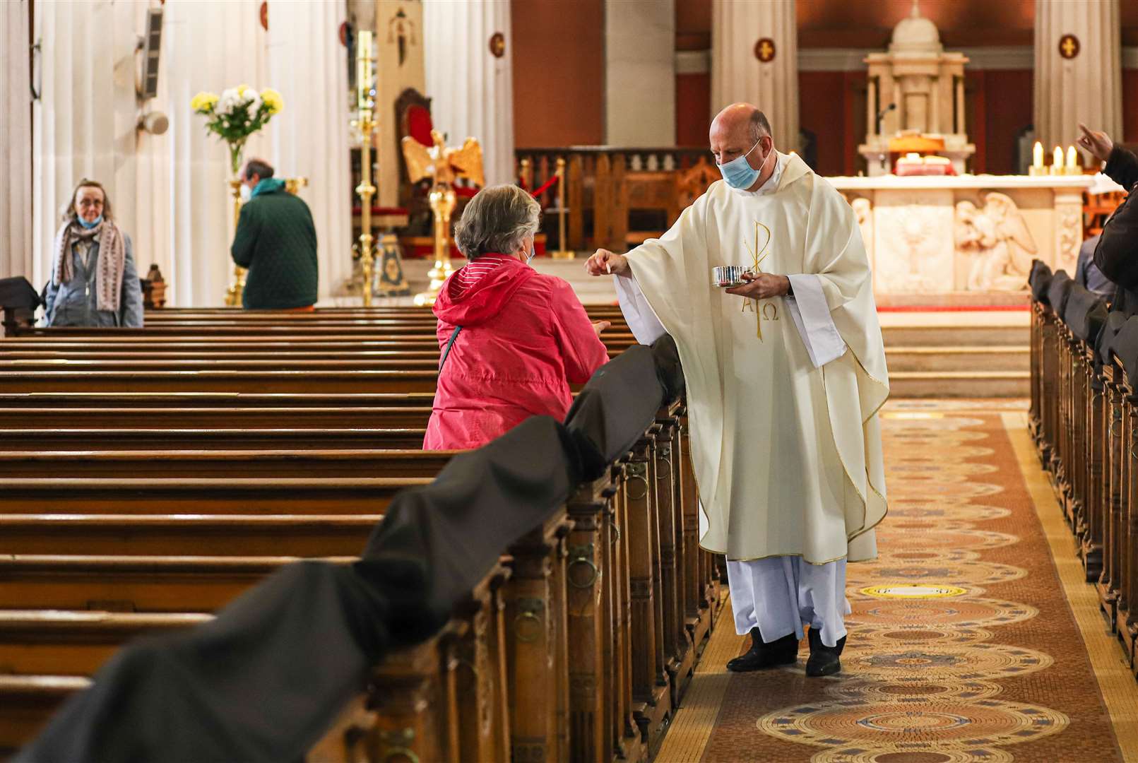 A priest celebrates Mass at Saint Mary’s Cathedral in Dublin (Damian Storan/PA)