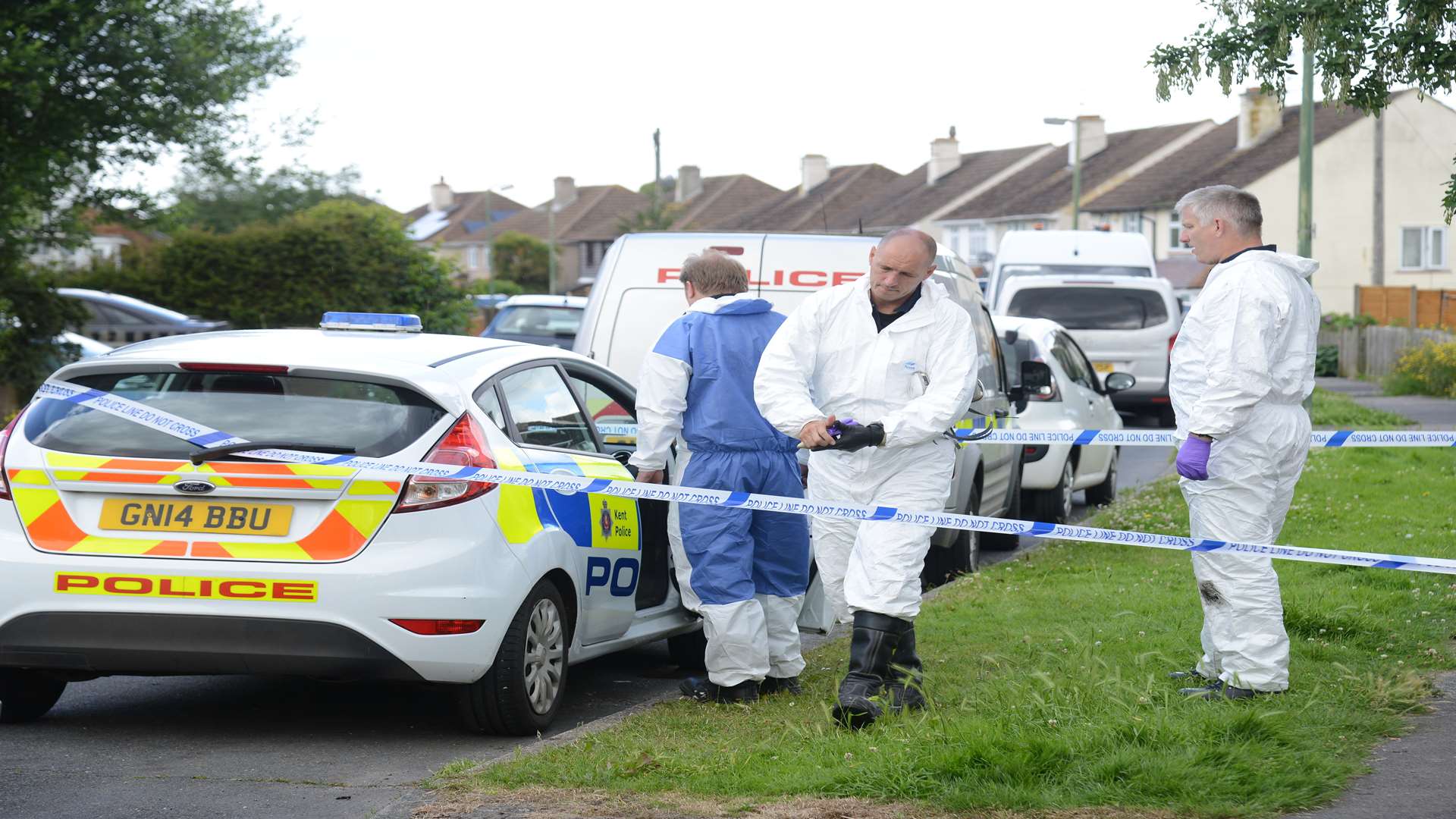 Flashback... forensic investigation teams at the scene of the fire