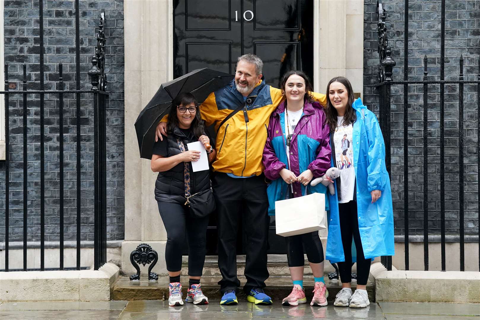 Figen Murray at Number 10 Downing Street with her husband Stuart and daughters Nikita Murray and Louise Webster (Stefan Rousseau/PA)