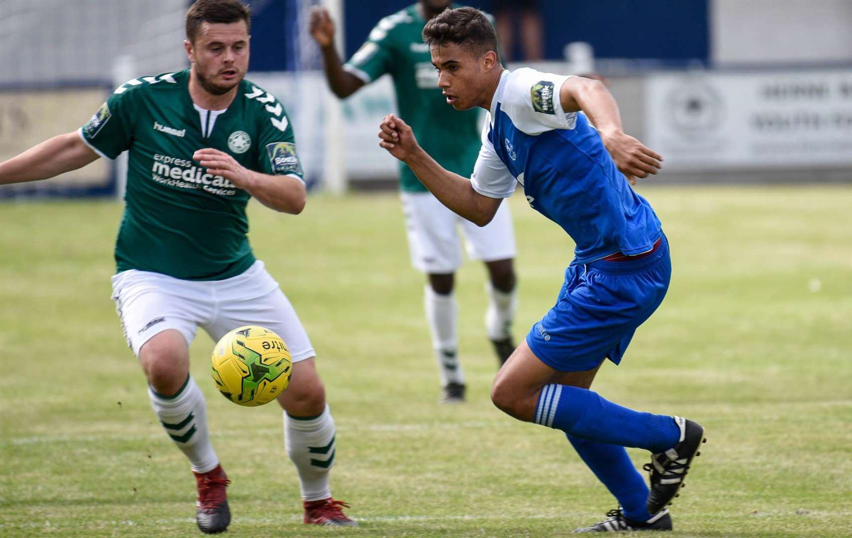 Herne Bay's Connor Wilkins (blue) Picture: Alan Langley