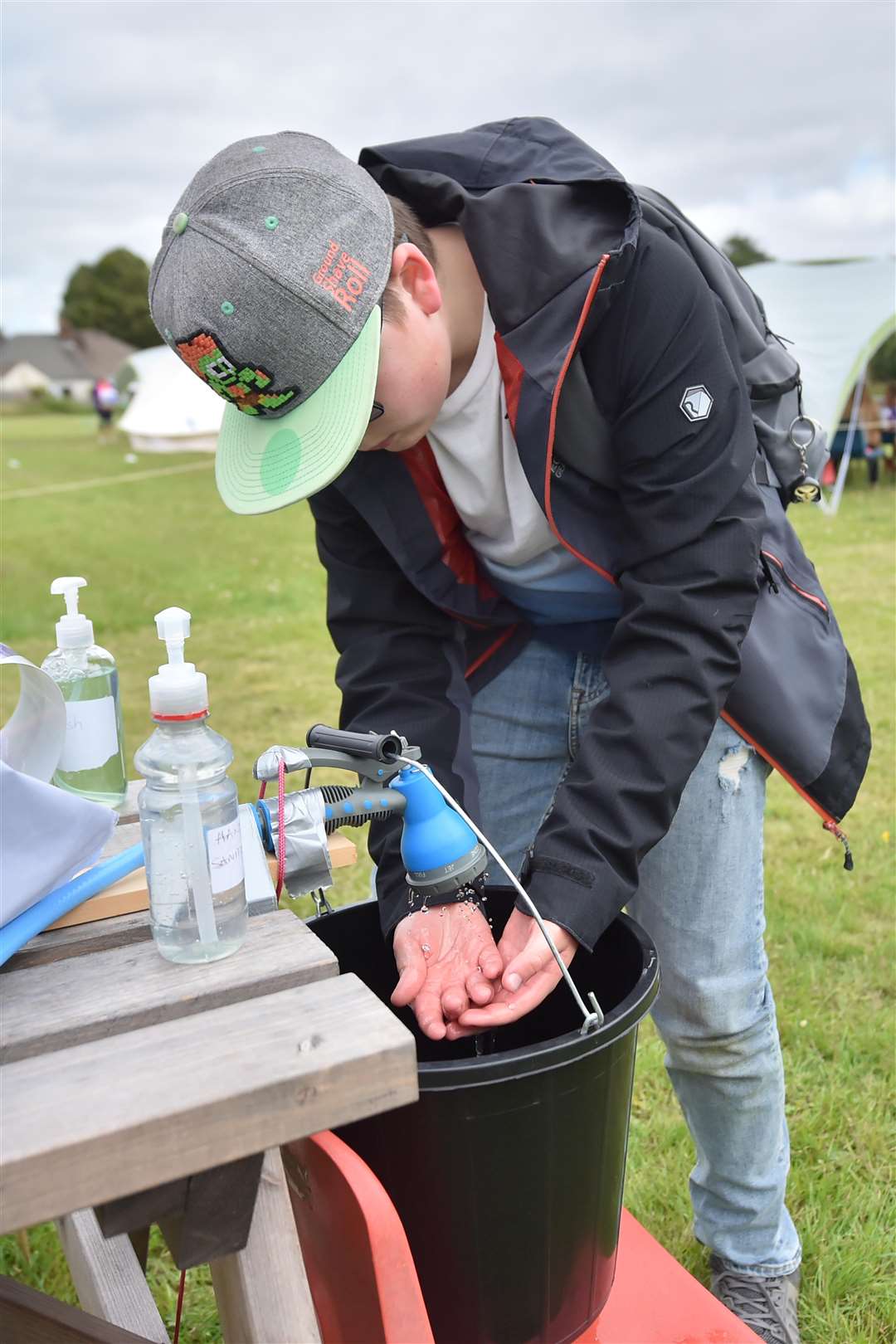 Year six pupils wash their hands at a temporary wash and sanitising station last year at Llanishen Fach Primary School in Cardiff (Ben Birchall/PA)