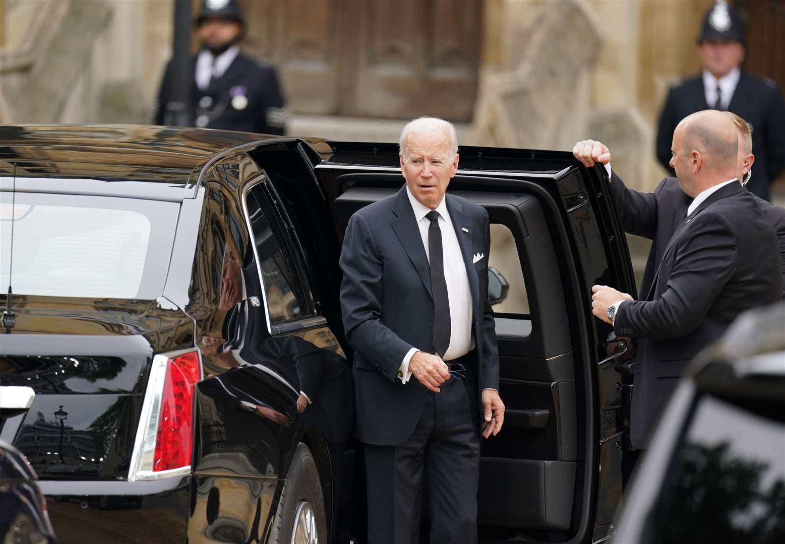 US President Joe Biden arrives for the Queen’s state funeral in the presidential armoured vehicle dubbed The Beast (Andrew Milligan/PA)