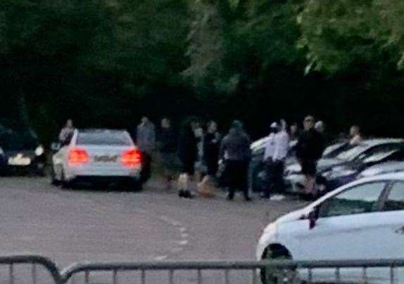 The group gathering during one evening at the car park