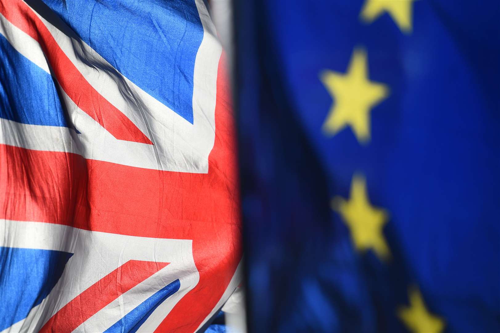 File photo dated 28/01/19 of Union and European Union flags outside the Houses of Parliament, London. Theresa May has warned MPs that if they fail to back her Brexit deal at the third time of asking then Brussels might insist on a lengthy delay, potentially scuppering chances of leaving the European Union altogether.. (43703444)