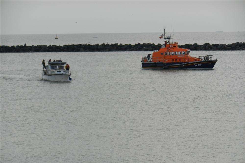 Safely back at Ramsgate harbour: the Dutch cabin cruiser and the all weather Ramsgate lifeboat, one of two RNLI vessels that went to the rescue of the stricken European visitor out at sea.