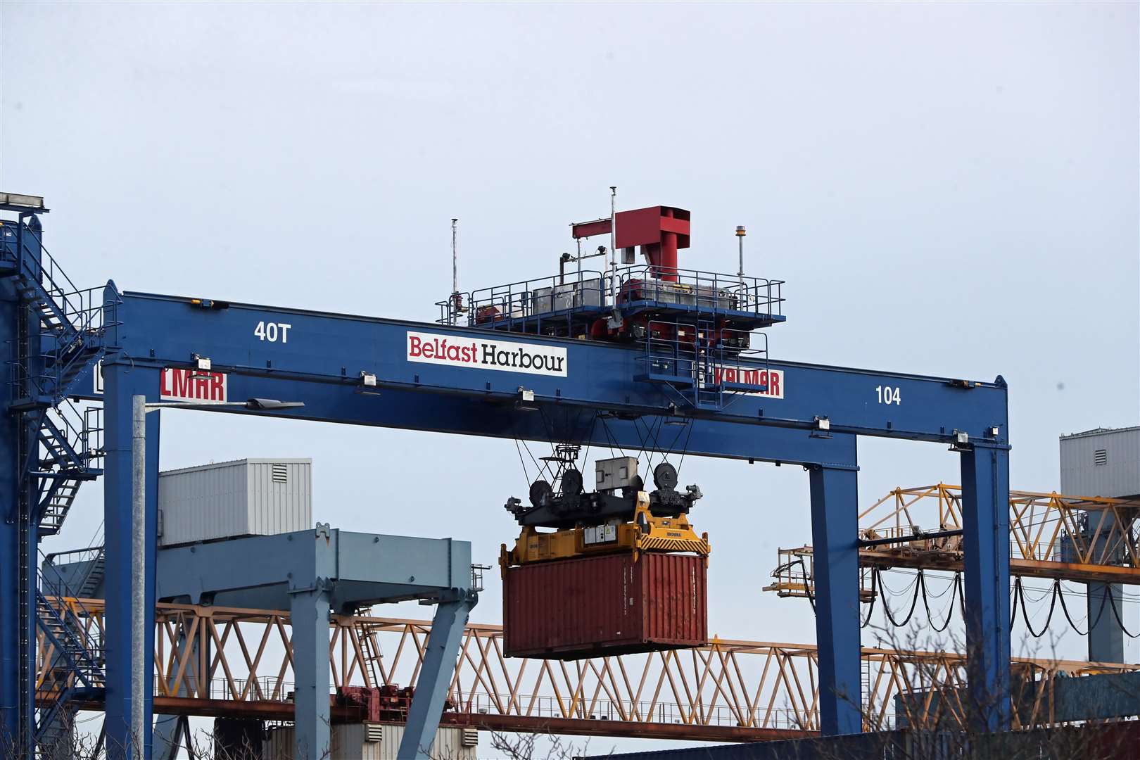 A cargo crate being moved in Belfast Port. Lawyers have been asked to provide an opinion on the DUP’s latest bid to undermine the contentious Northern Ireland Protocol, which governs Irish Sea trade between Great Britain and the region post-Brexit (Niall Carson/PA)