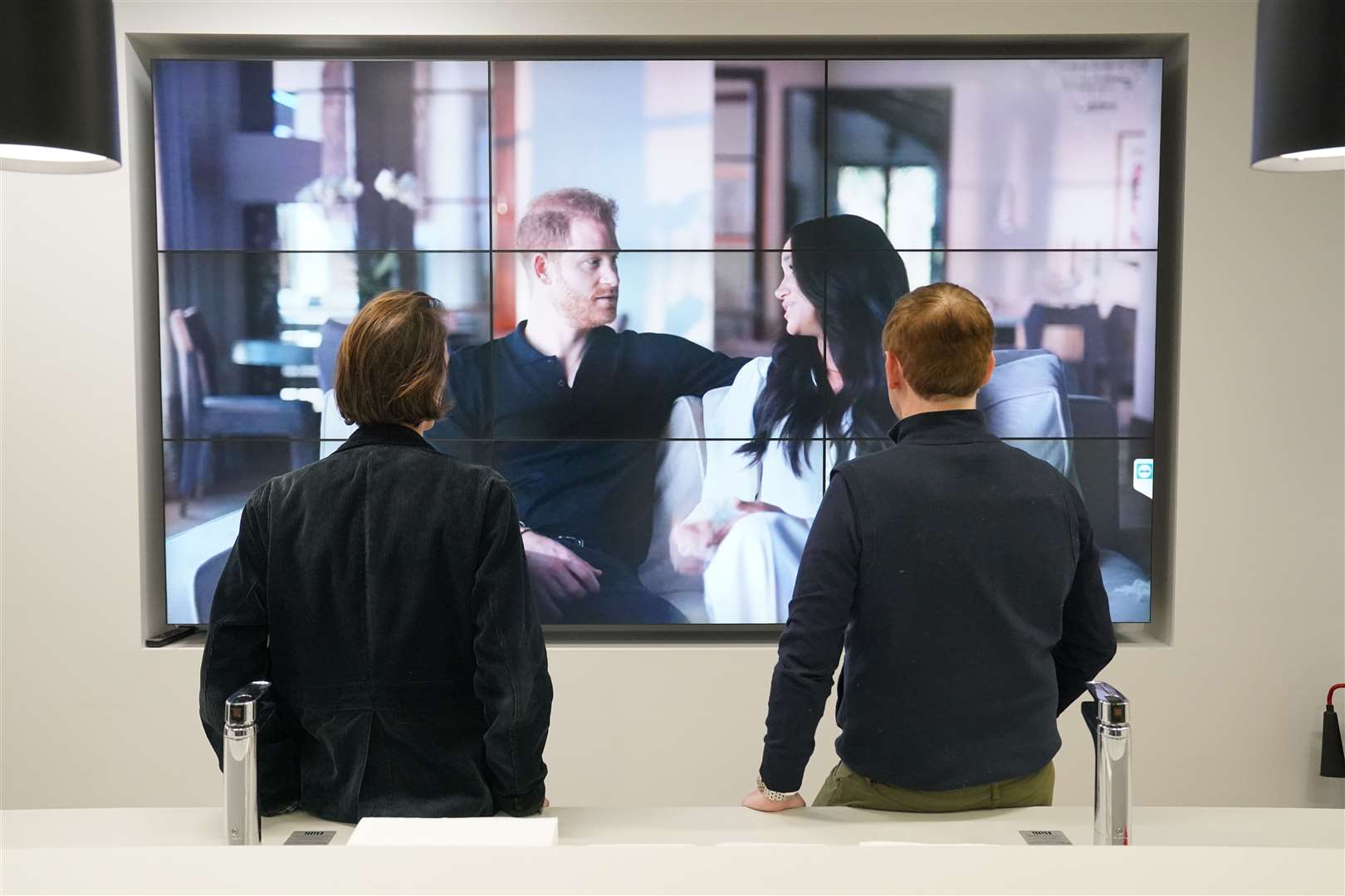 Office workers in London, watching the Duke and Duchess of Sussex’s controversial docuseries Harry & Meghan (PA)