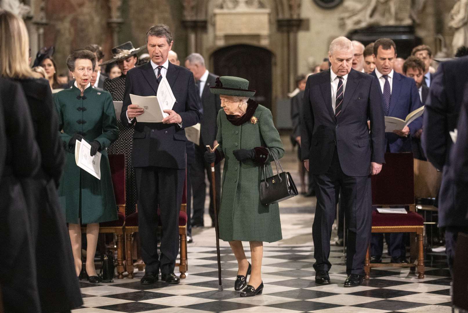 The Queen walks slowly in the aisle as the Duke of York and his sister Anne look on (Aaron Chown/PA)