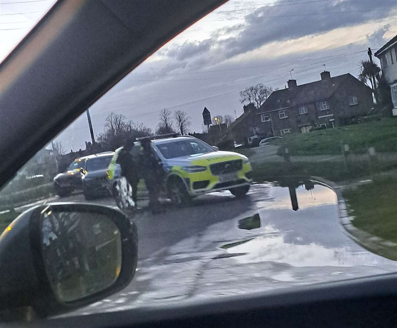 A police car and two officers in St Johns Avenue