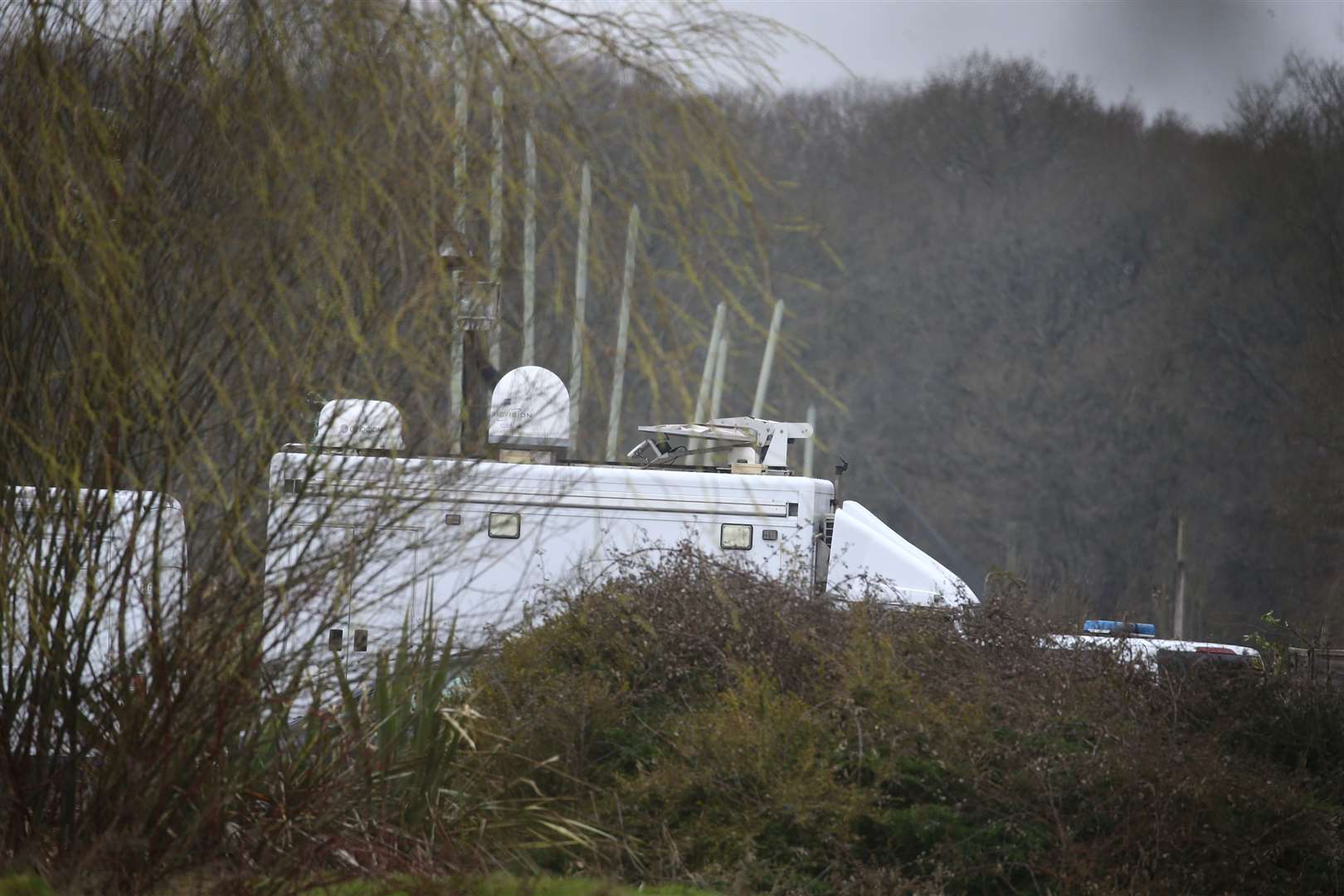 A police vehicle with a satellite antenna and telecommunications systems arrives in Great Chart near Ashford, Kent (Gareth Fuller/PA)