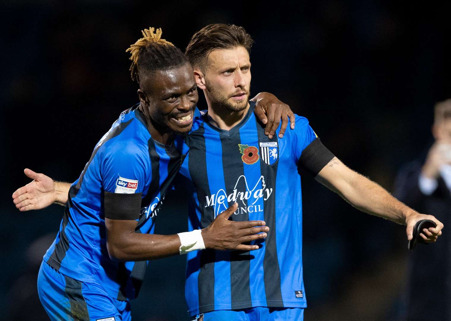 Gabriel Zakuani and fellow defender Luke O'Neill celebrate at the final whistle on Saturday Picture: Ady Kerry