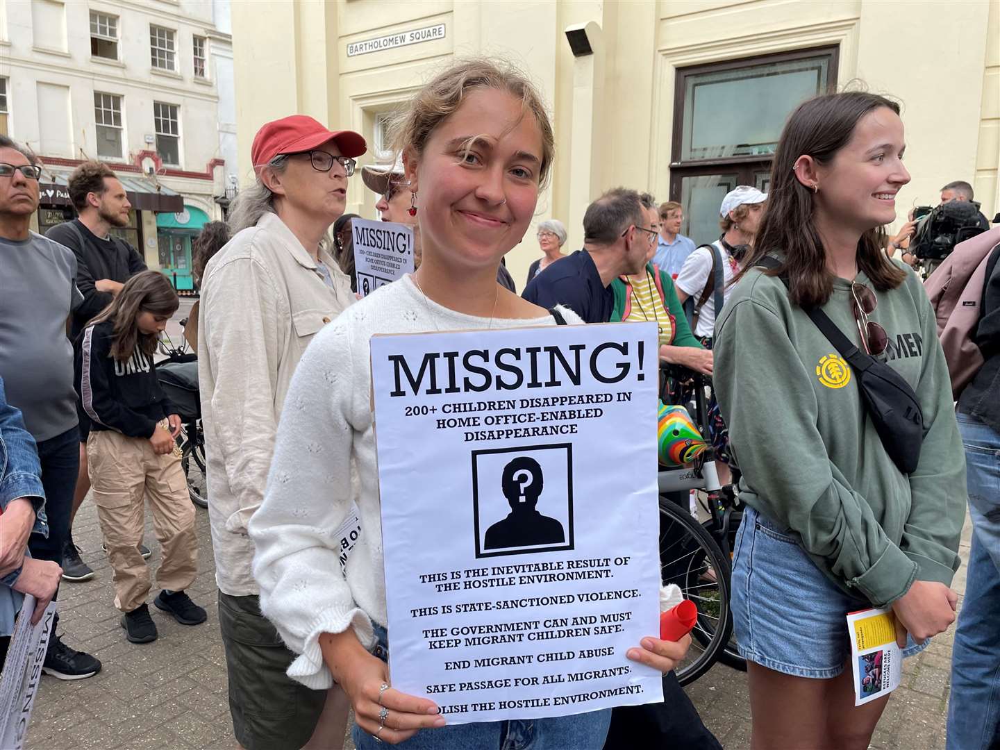 Protester Riki Strickstrock holds a sign opposing the Home Office plans (PA)