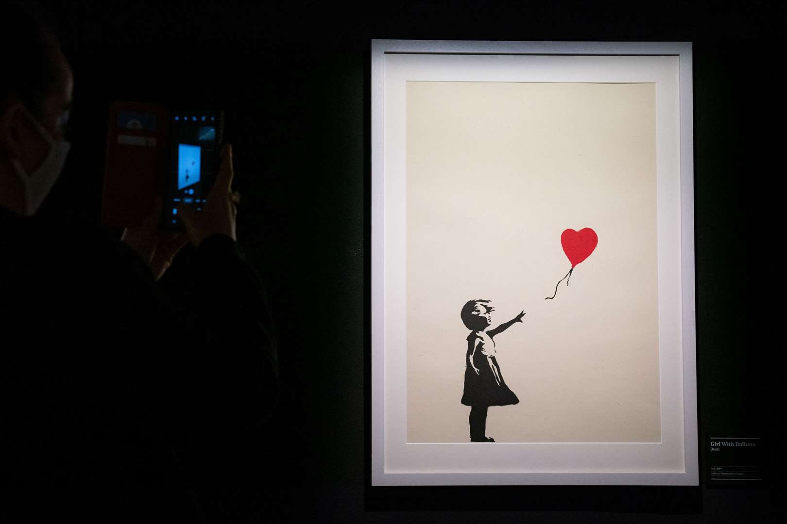 Girl With Balloon was one of Banksy’s best-known works before he partially shredded it and it was renamed Love Is In The Bin (Aaron Chown/PA)