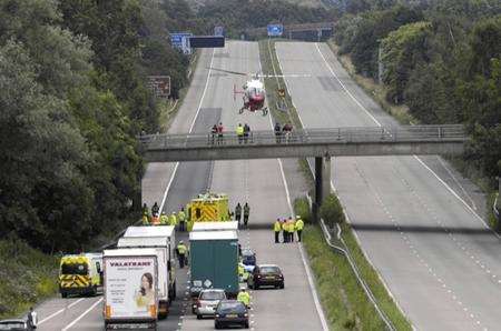 The air ambulance takes off after a woman, 20, fell from a bridge over the M20 at Kennington. Picture: Gary Browne