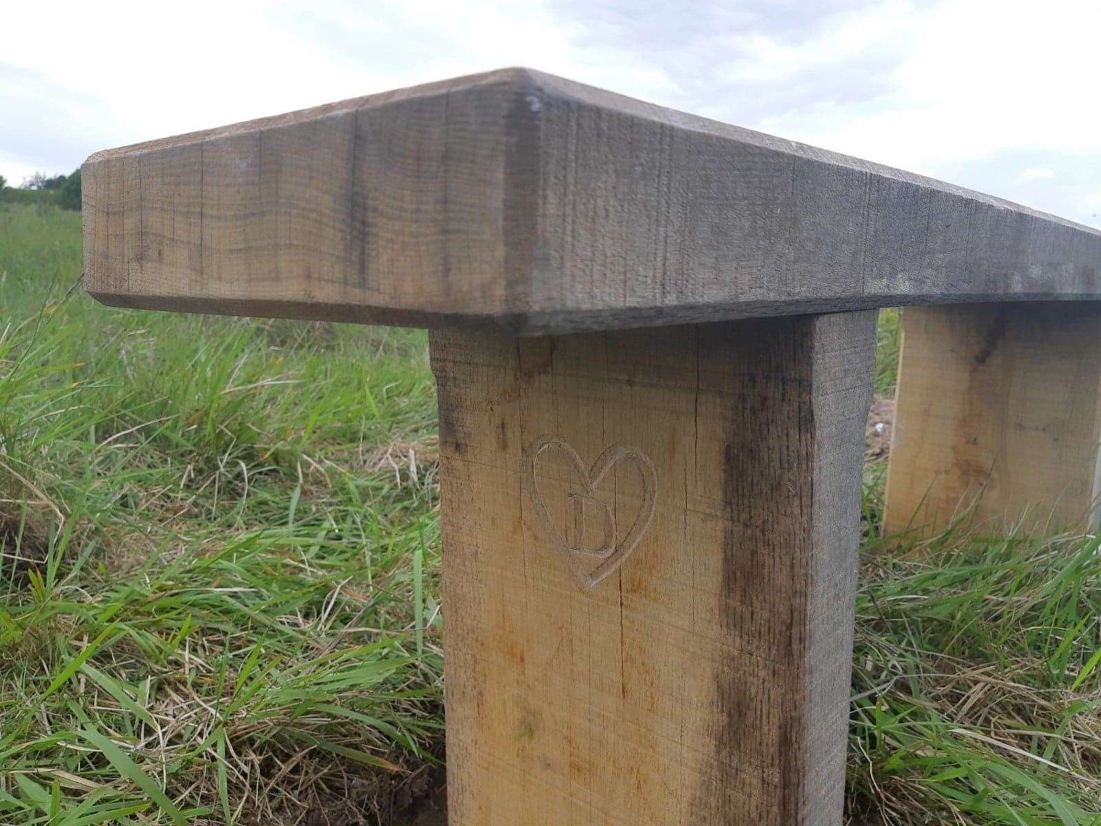 The solid oak wood bench has been scribed with a 'D'