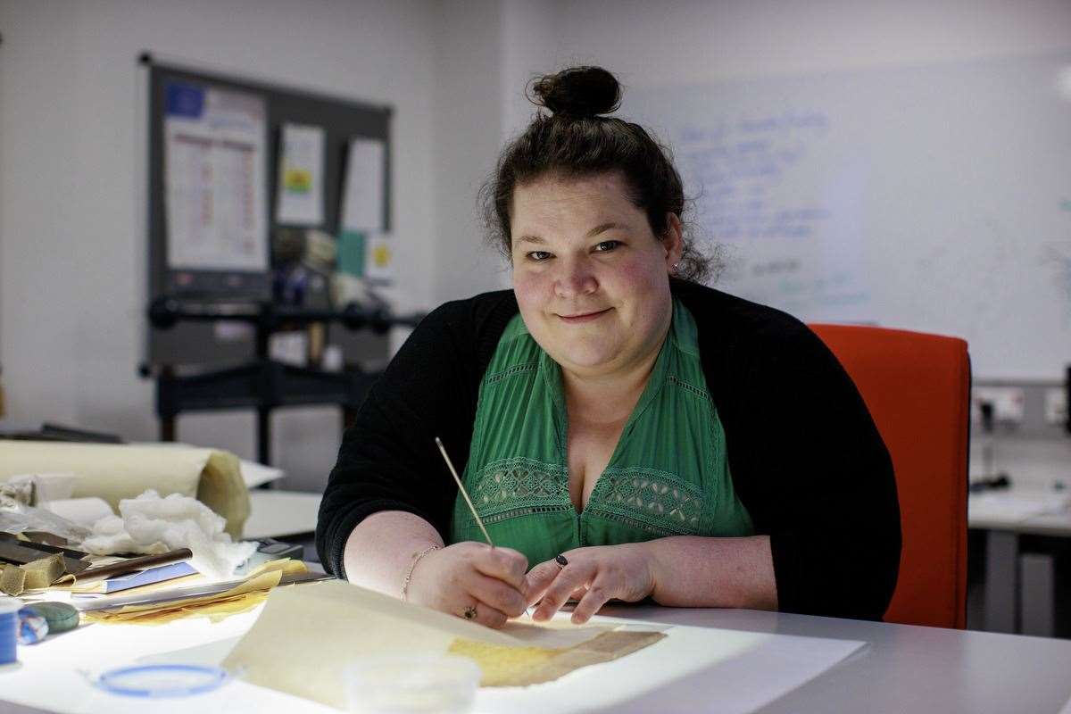 Sarah Graham undertaking conservation work on the delicate documents (Liam McBurney/PA).