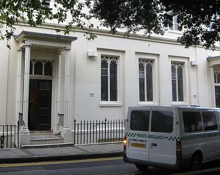 A private ambulance leaves the scene where a man's body was found in Hawley Square, Margate.