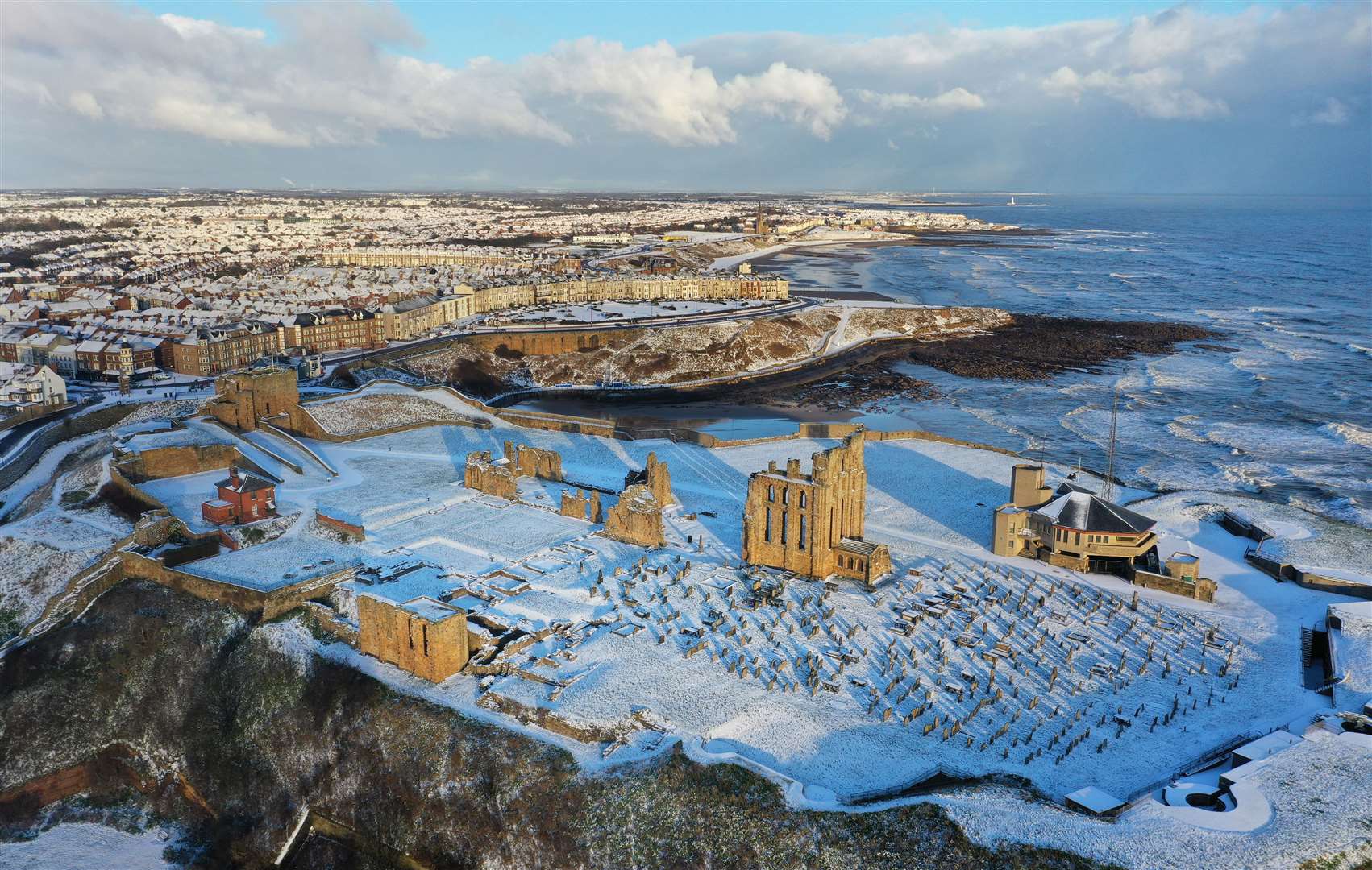 Snowfall over Tynemouth Priory (Owen Humphreys/PA)